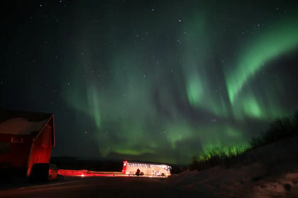 Northern lights over the red house